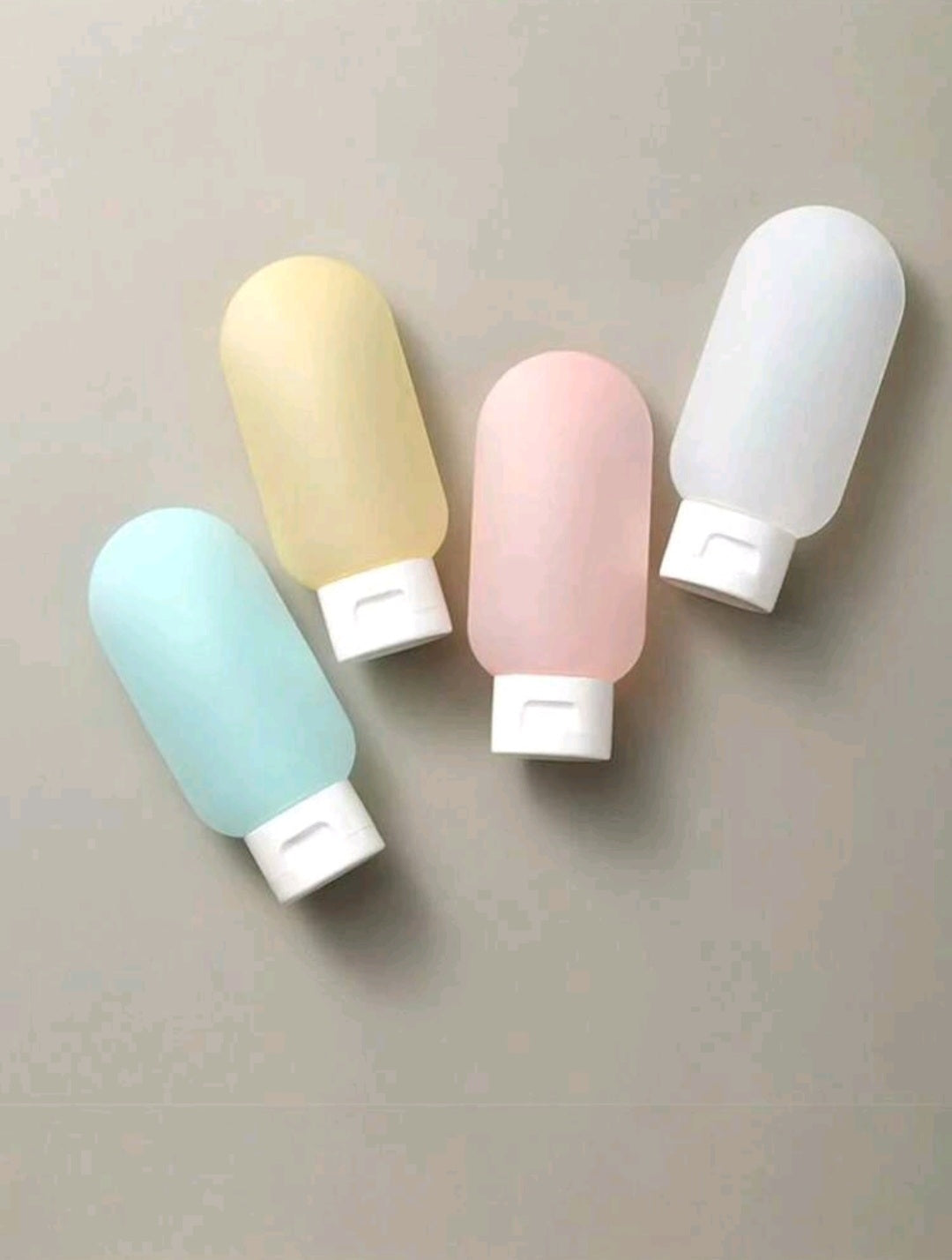 4 Pieces Set Silicone & Plastic Travel Bottles; Refillable, Leakproof Cosmetic containers for Lotion, Shower & Skincare products - 60 mL